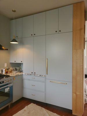 Custom built kitchen with modern narrow face frame and Oak detailing.