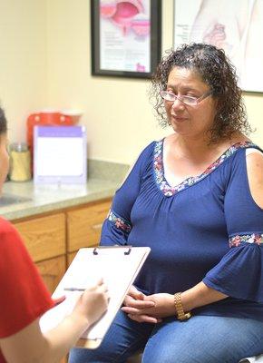 Specialist Zulema assisting a patient