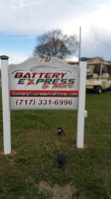 Battery Express sign I front of building seen along Warm Spring Rd