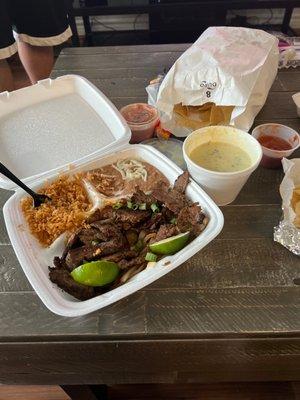 Couldn't wait to dig in lol... steak fajitas and white queso, chips and salsa :)