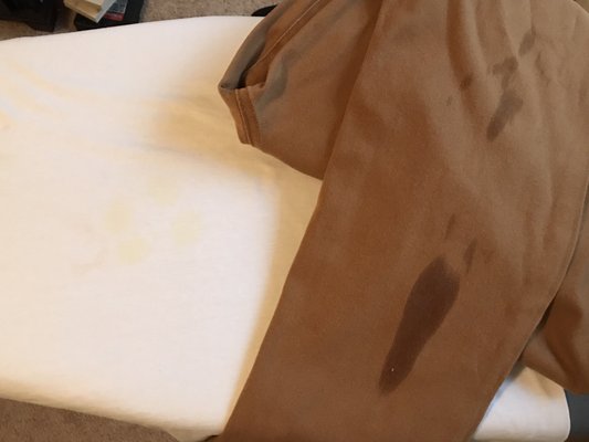 White yellow stains and marks on pants. Left several messages for owner to call me. No response going 3 weeks as of now!!