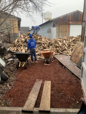 Bono Fires team unloading a truck of top quality fire wood.