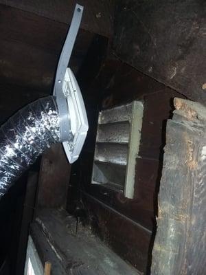 exhaust fan hanging in the attic