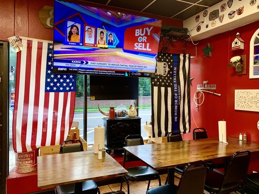 Man Cave Ambience with big TV & walls filled with things to look at while you eat or wait! 5*