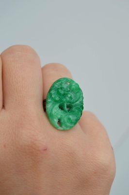 This ring is a rich green color, pressed glass with etched flowers. I was told it's from Japan in the 1950s