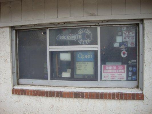 Main window, left of the front entry.