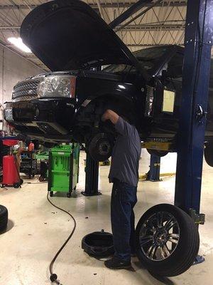 This is just one of our awesome Techs bleeding the brakes on a customers Range Rover