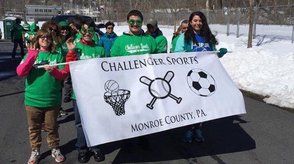 Team members carrying our banner at the Saint Patrick's Day Parade in the Stroudsburgs