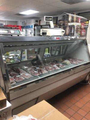 Halal lamb, beef, and chicken are on display. Custom orders can be made via telephone.