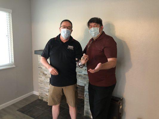 Steve & Eric wearing their masks for purchasing a home during the COVID reqtriction.