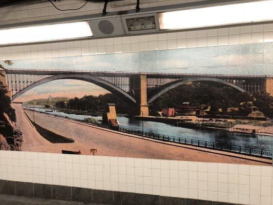 Wall art showing the Washington Bridge, which crosses the Harlem River down the street from the station. It's 2 blocks away.. (1/13/2019)