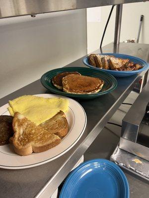 The breakfast pictured below is a scrambled egg with toast and sausage patties, 2 pancakes, and the Opie's with bacon!