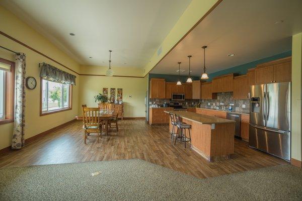 Share a home-like kitchen and dining area.