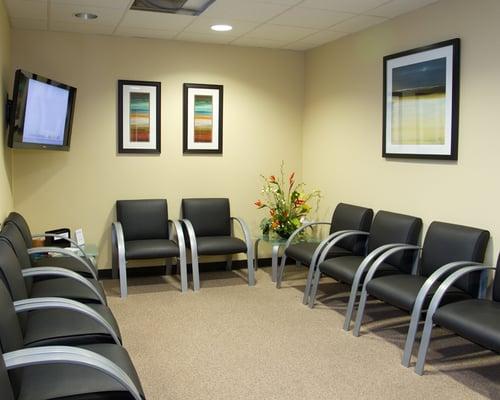 This is our waiting room. Nice Comfy chairs with a television.