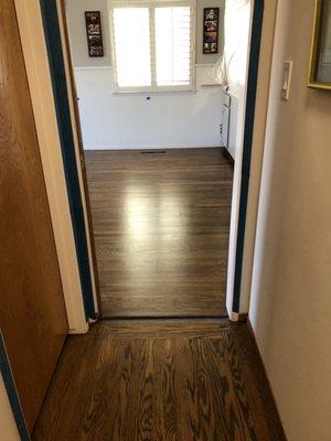 Hallway floor is existing & living room floor was installed to match. Don't mind the lighting-Pretty close to perfect match!