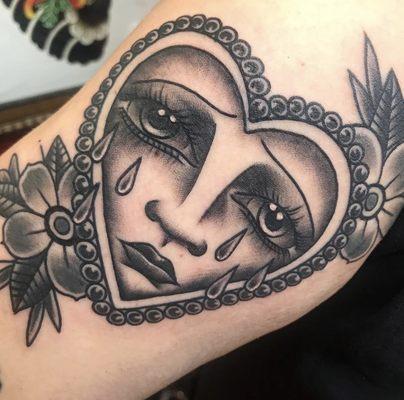 By Anna Waychoff black and gray crying heart and flowers tattoo