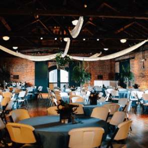 Historic ballroom loaded with charm. Onsite table and chair rentals available.