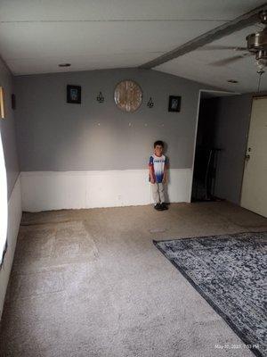 My son standing on the new carpet