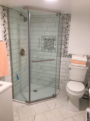 Complete bathroom remodel with tile shower walls and floor