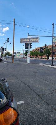 Street sign blocked by the signal lights driving down Wells Ave . But you can see it from the parking lot...lol