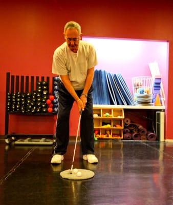 A patient working on his exercises in the movement studio