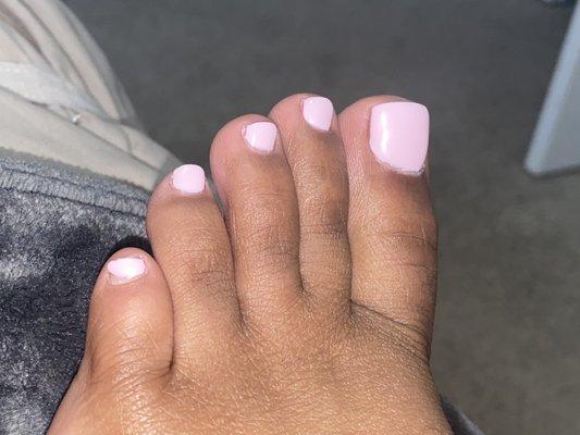 Look at my pinky toe. I have gel polish so the polish didn't chip. Like she literally didn't polish the entire toe nail.