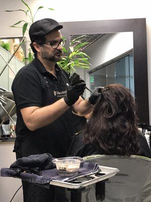 The owner doing a root touch up and a keratin complex keratin treatment.