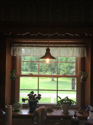 Installed light fixture with Edison bulb.