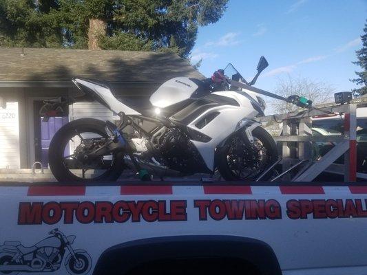 Kawasaki Ninja on their custom motorcycle trailer.