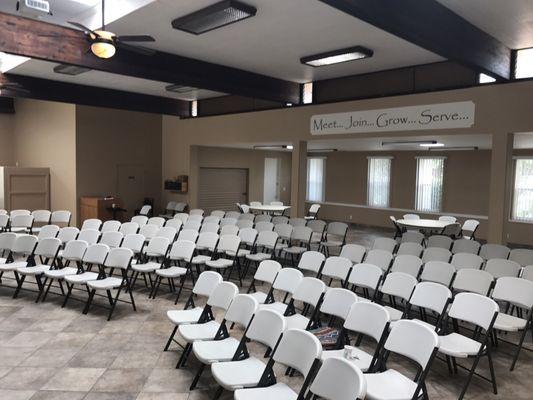 Many seats in the fellowship hall