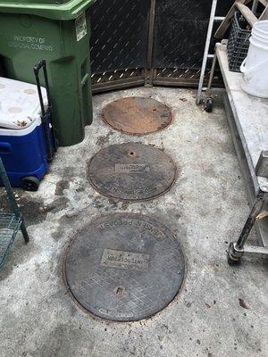 These are the lids to a grease interceptor tank at a local restaurant.