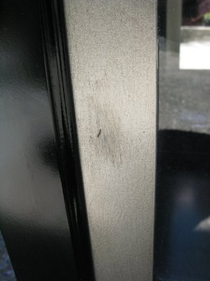 The worst flaw needing repair on door front.