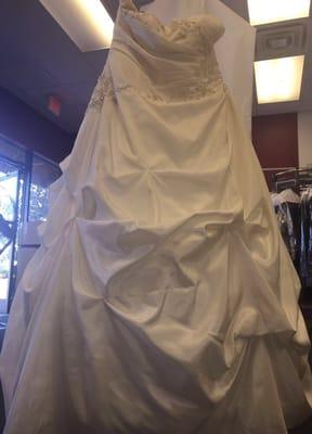 We dry clean, press, steam & preserve wedding dresses on-site!