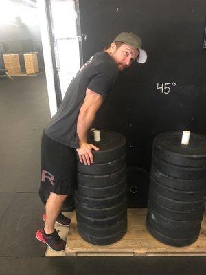 Coach JV "stretching his back"(humping some weights).