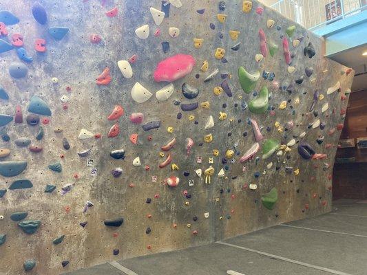 The upstairs bouldering wall - you can top out to a slide that takes you back downstairs!