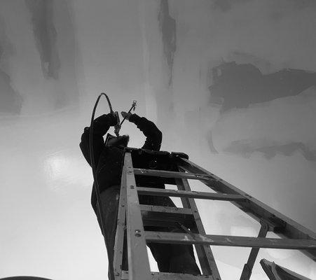 Our contractor, painting ceilings for a client