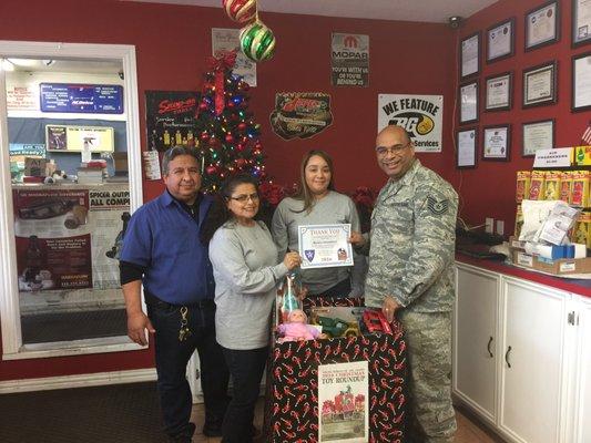 Mario's Automotive receives a Certificate of Appreciation for the 2016  annual Texas Guard Toy Drive.