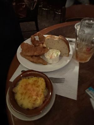 The fish dinner, with the Au Gratin potatoes in the foreground.