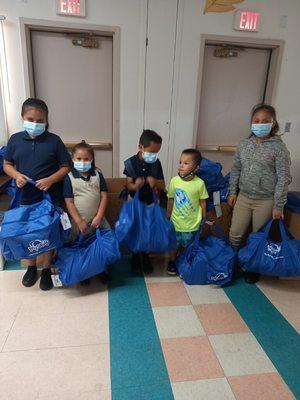 Children at The H.E.L.P.E.R. Foundation receiving My Stuff Bags