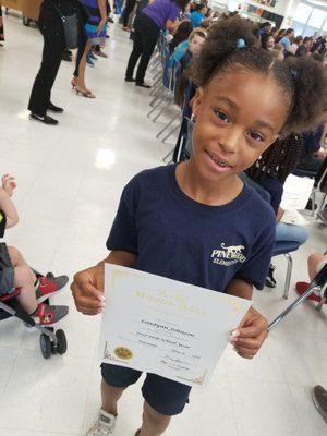 My daughter receiving her honor roll award.