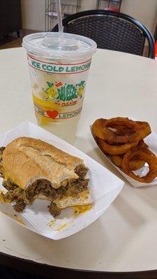 Whiskey battered Onion rings with Philly cheese steak and a lemonade shake up