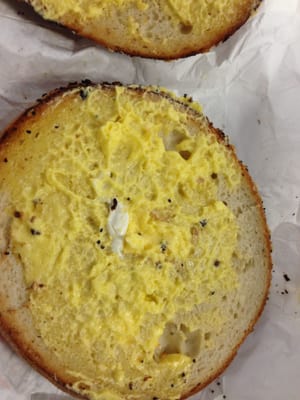 this is supposed to be toasted bagel with butter (not egg salad).  not sure why it is so yellow. you can see tiny spot of normal butter.