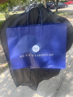 Jacket/pants with the tie and shirt inside blue bag