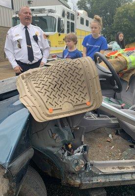 Covering the sharp elements of the car so the audience could see up close how machines were used in the extrication demonstration.