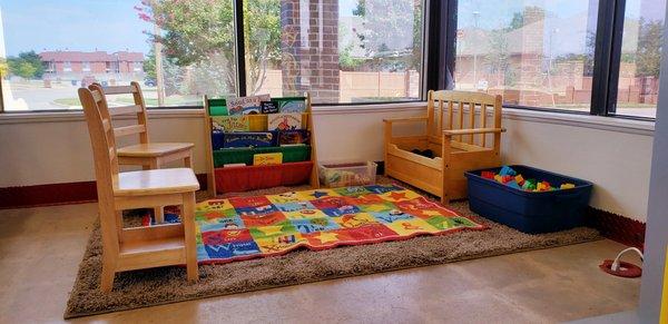 Kids have a place of their own in the laundromat with toys and books.