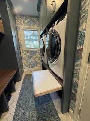 Combination Mudroom and laundry room. With raised washer and dryer