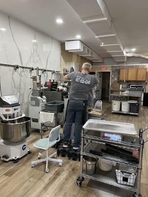 Owner making pasta