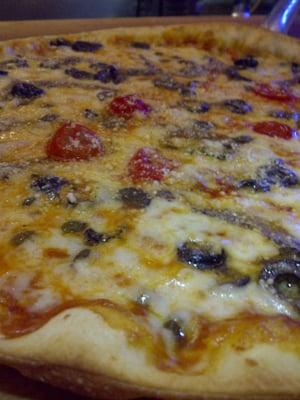 Janet's Napoletana: Onions, olives, garlic, tomatoes, capers, anchovies, homemade tomato sauce, and 4 cheese blend.