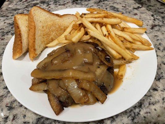 Small hamburger steak meal (- the salad) taken to-go.