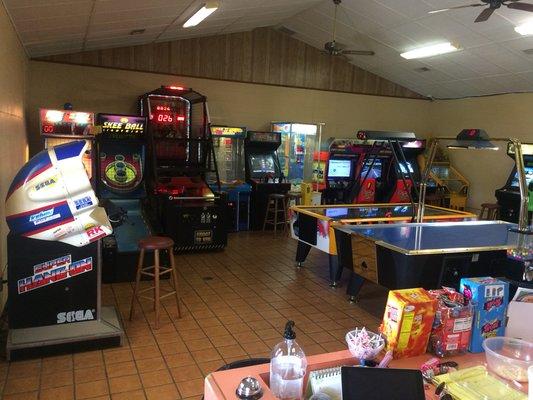 We have 23 modern and vintage arcade games including Ms. Pac-Man, Galaga, racing games, and air hockey tables.